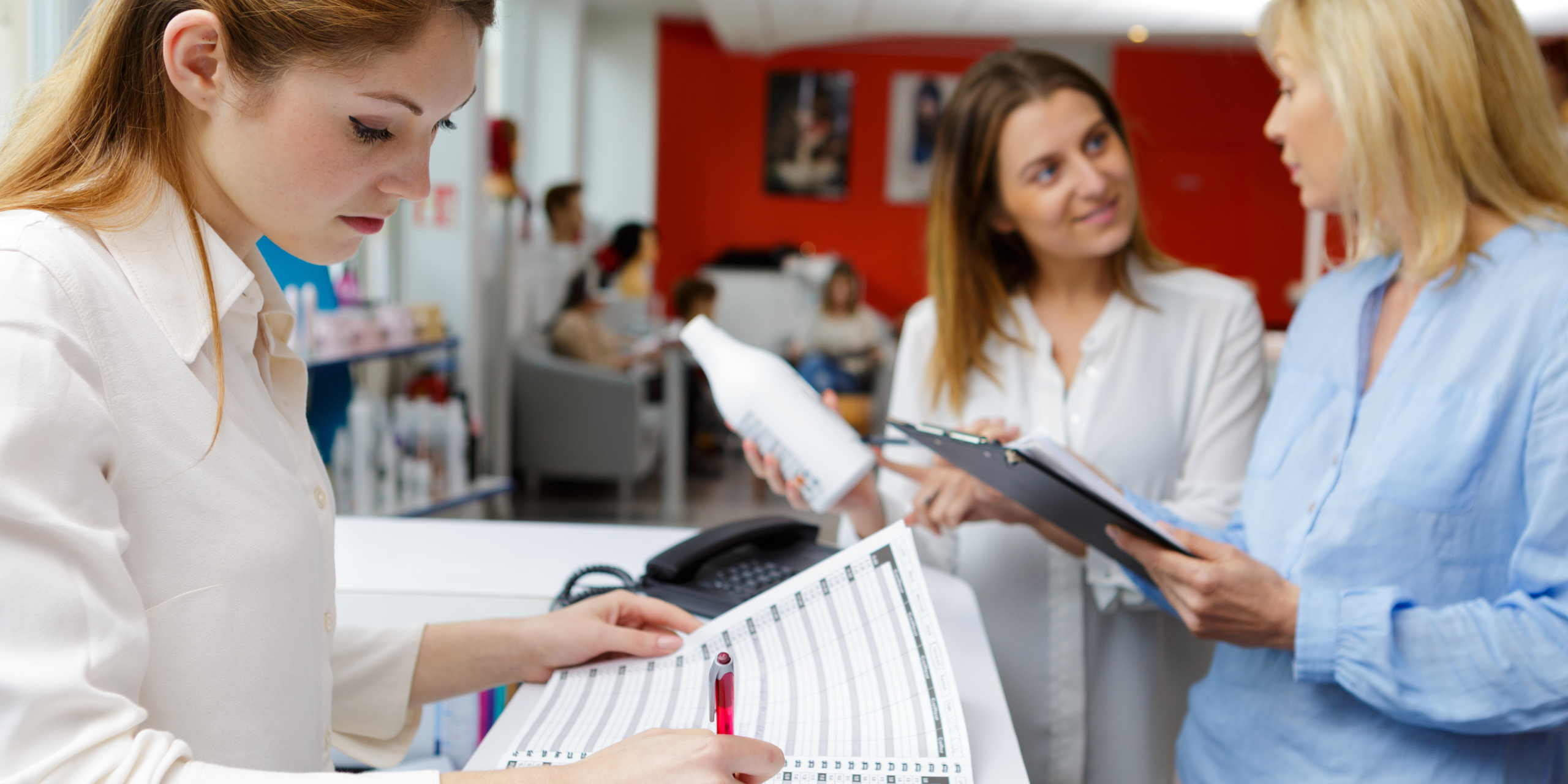 GV_Blog2_LevelSheets Woman working at front desk of a cosmetology school